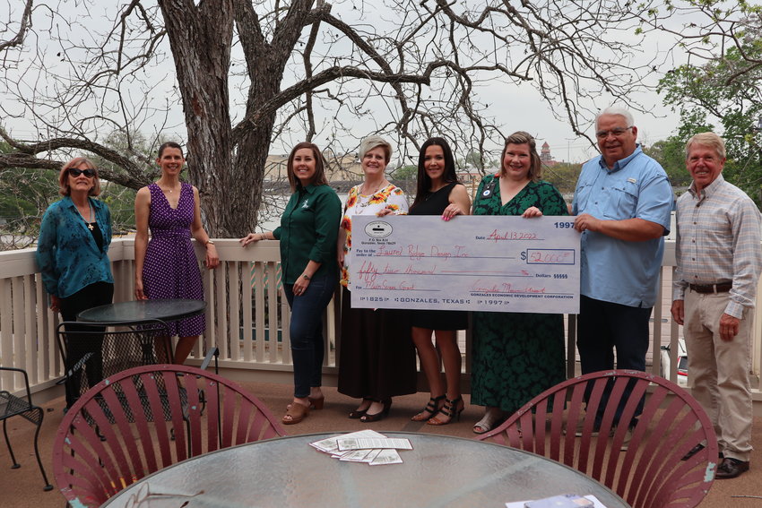 Laurel Ridge Antiques and Gifts recently received reimbursement for projects completed on the historic three-story brick structure. From left are Barbara Crozier of Laurel Ridge, Candice Granger of Laurel Ridge, Main Street Board President Britney Jones-Caka, Gonzales Main Street Director Tiffany Hutchinson-Padilla, Main Street board member Adriane Hastings, Main Street board member Christine Presley, GEDC President Andy Rodriguez and Richard Crozier of Laurel Ridge.